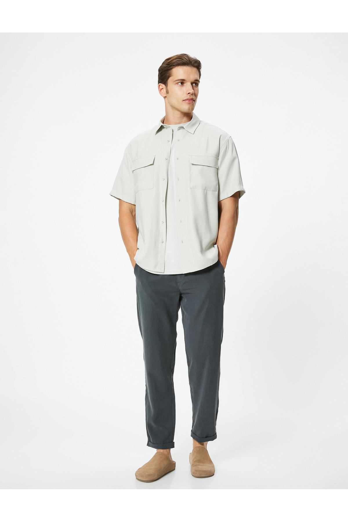 شلوار گاباردین با دور کمر توری و جزئیات جیب